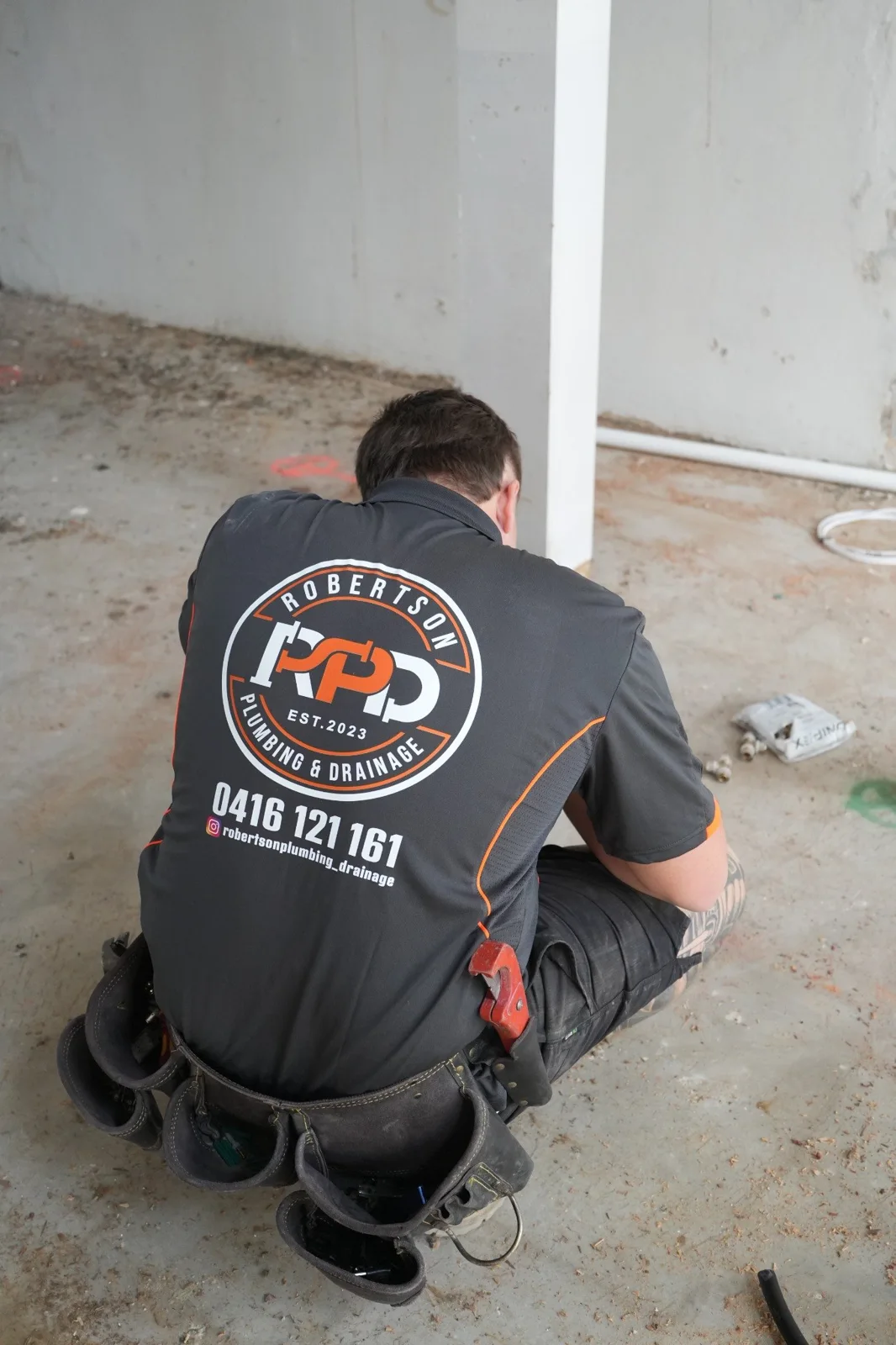 Robertson plumber carrying out installation work