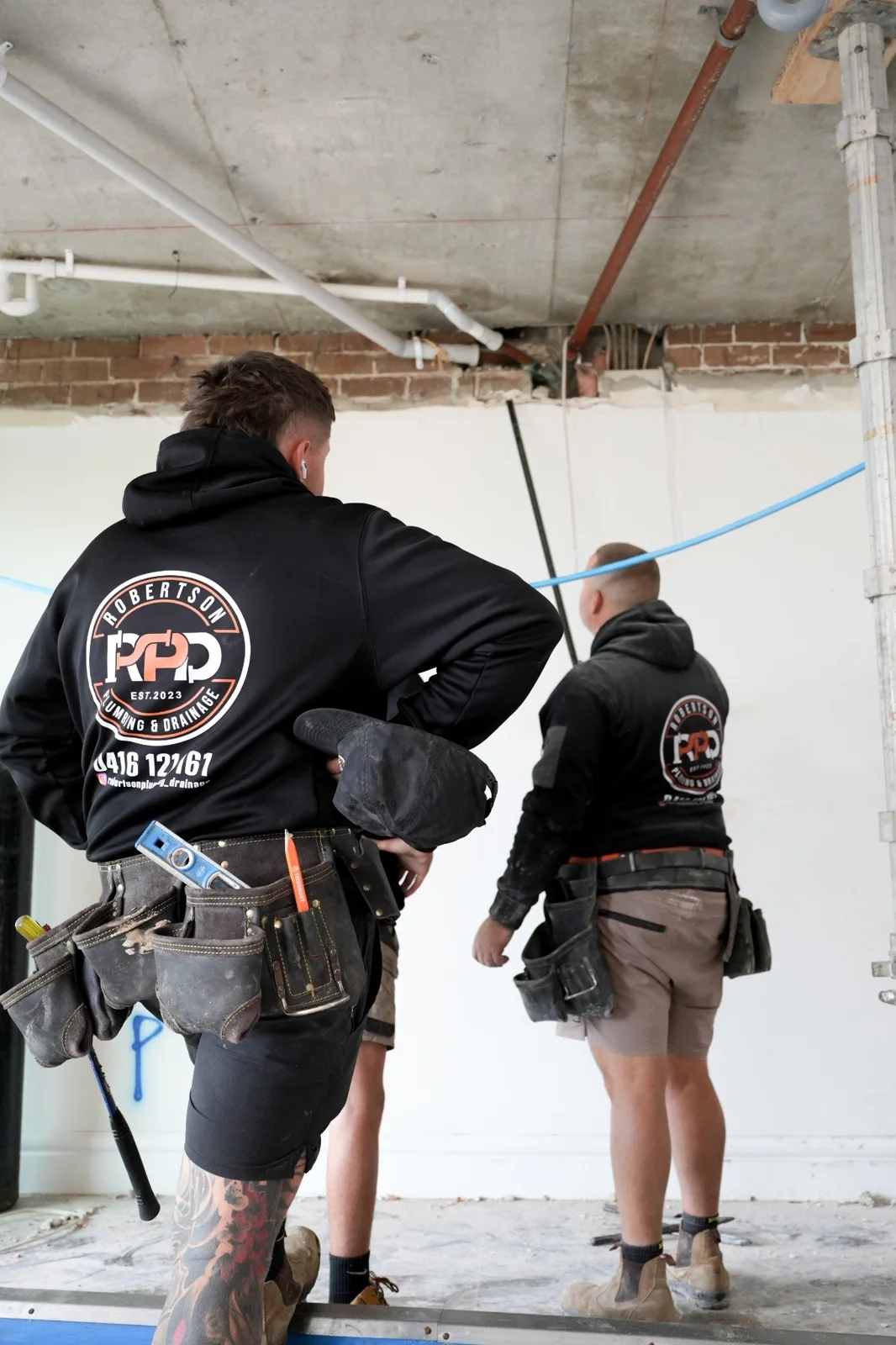 Robertson Plumbing & Drainage plumbers coordinating a construction rough-in